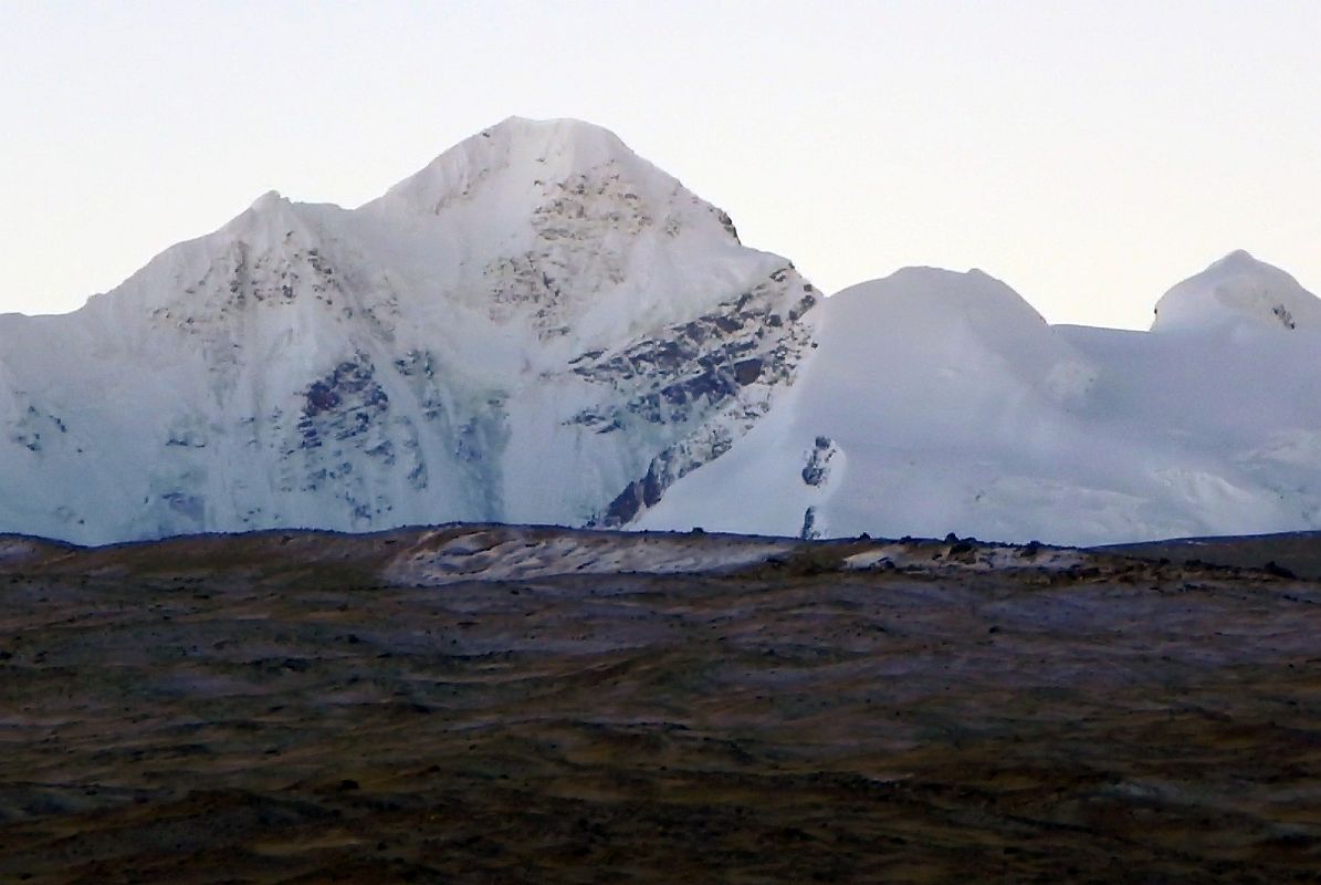 14 Langtang Ri At Sunrise From Shishapangma North Base Camp Langtang Ri (7239m) is the second mountain to the northwest of Shishapangma at sunrise from Shishapangma North Chinese Base Camp. Langtang Ri was climbed for the first time by Noboru Yamada, Makihiro Wakao, Soichi Nasu and Ang Rinji Sherpa on October 10, 1981 via the south ridge. On October 11, Minoru Iizawa and Isashi Nakaota also reached the top.